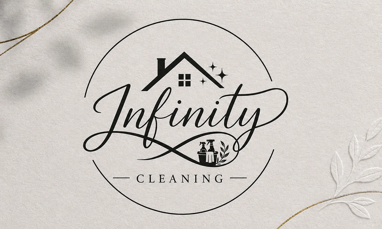 Infinity Cleaning logo: the word Infinity in calligraphy with a small house, sparkles and gold filigree on cream paper